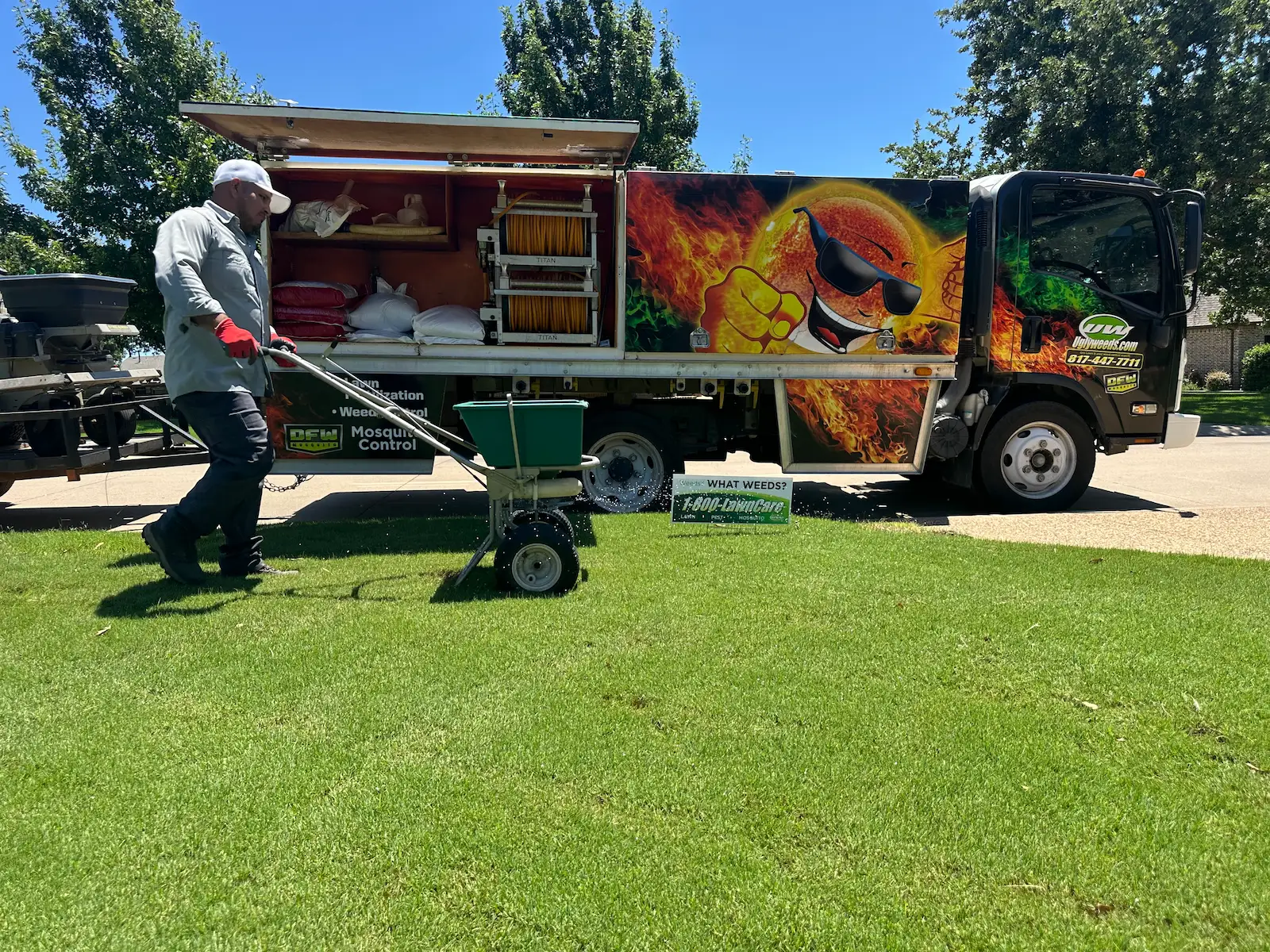 gro lawn tech treating lawn in front of company truck