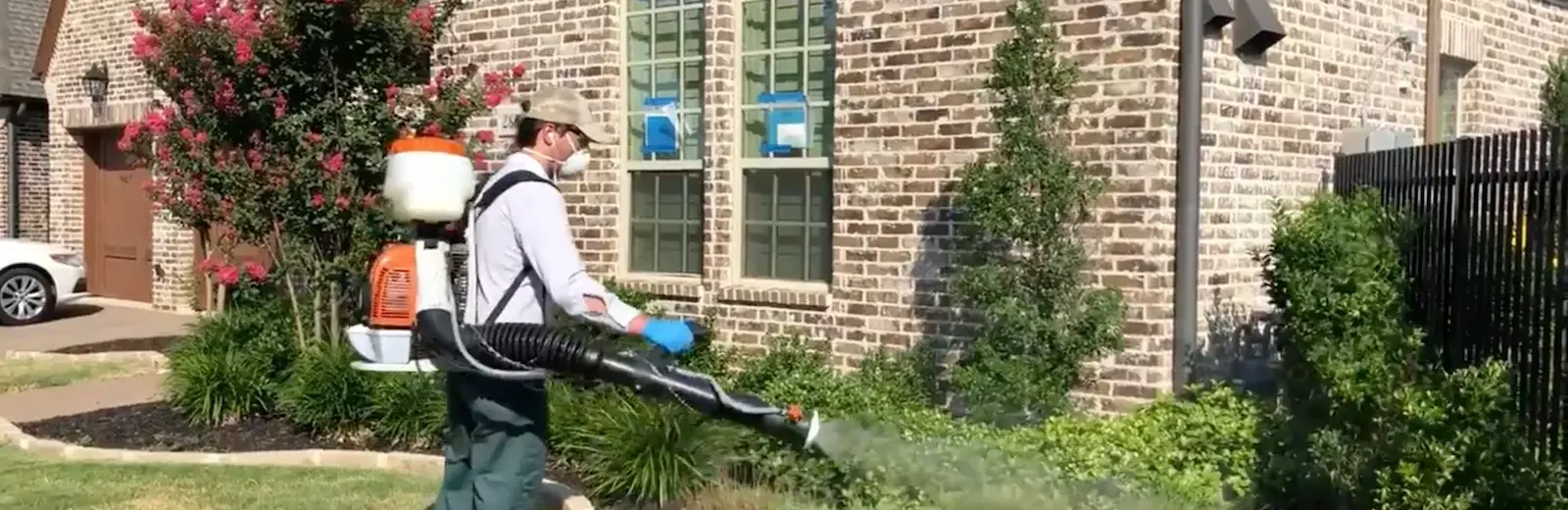 gro lawn tech spraying front yard bushes